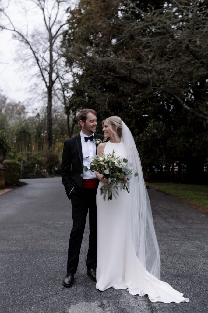 Bride and groom looking at each during their wedding portriats