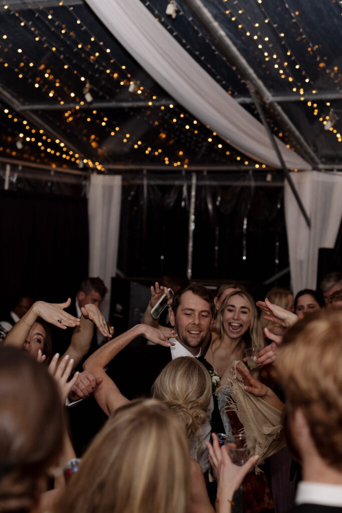 Groom dances with friends at his wedding in spartanburg sc