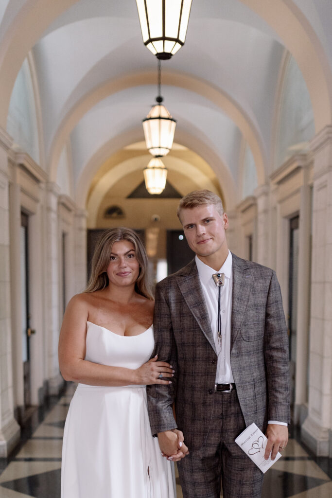 bride and groom looking at the camera