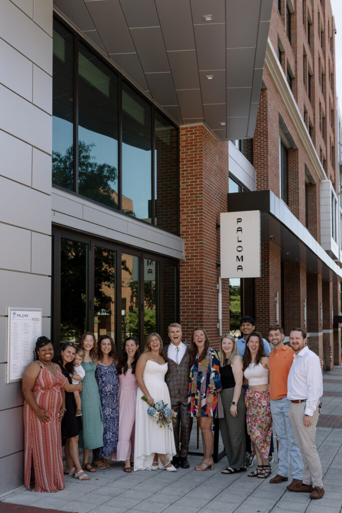 bride and groom celebrating with their friends Downtown Greenville SC