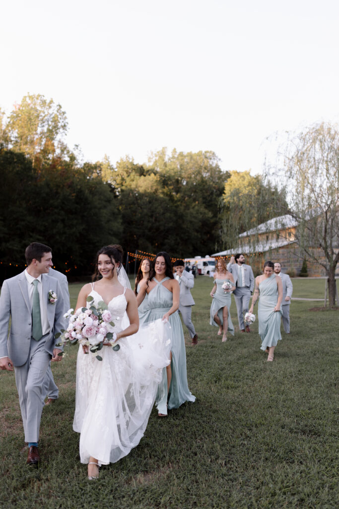 bridal party walking away from the venue 