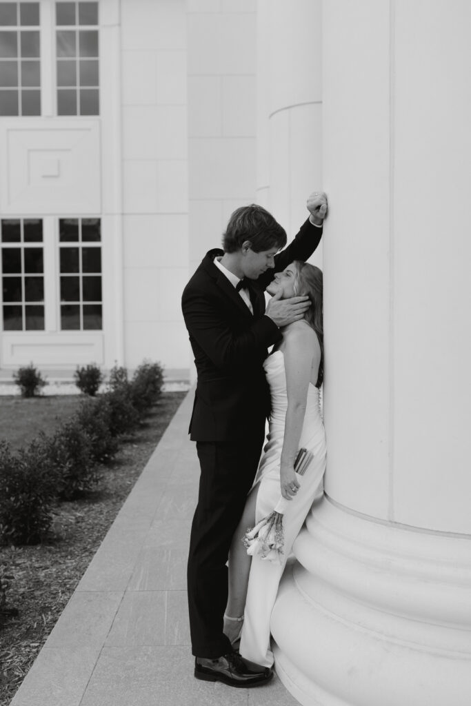 Groom holds bride's face after elopement at the spartanburg sc county courthouse. 