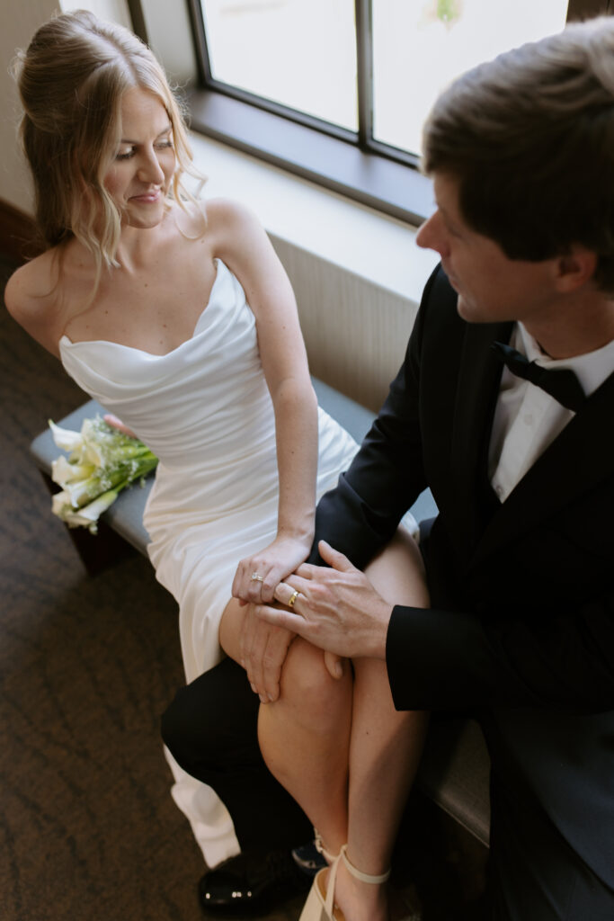 Bride and groom cozy in the courthouse after their elopement in spartanburg, sc. 