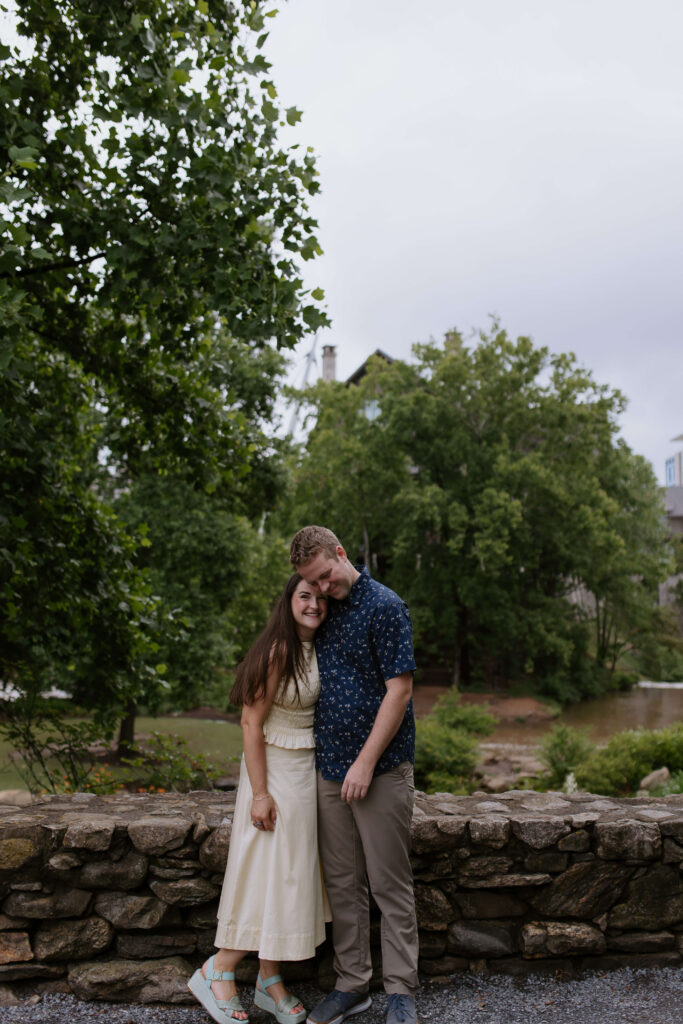 couple hugging on a bridge